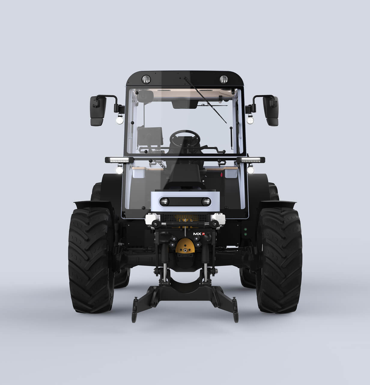 Front view of a modern black tractor with large tires, side mirrors, and visible cab interior, set against a plain light gray background.