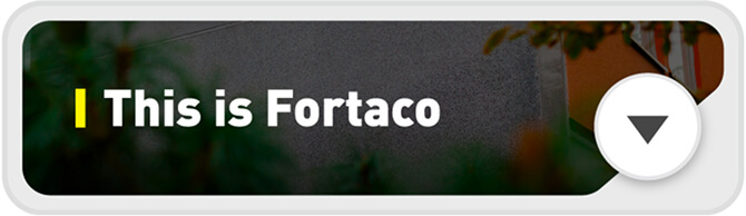 A rectangular banner with the text "This is Fortaco" in bold white letters on a dark background, featuring a yellow vertical line and a white downward-pointing arrow inside a circle on the right.